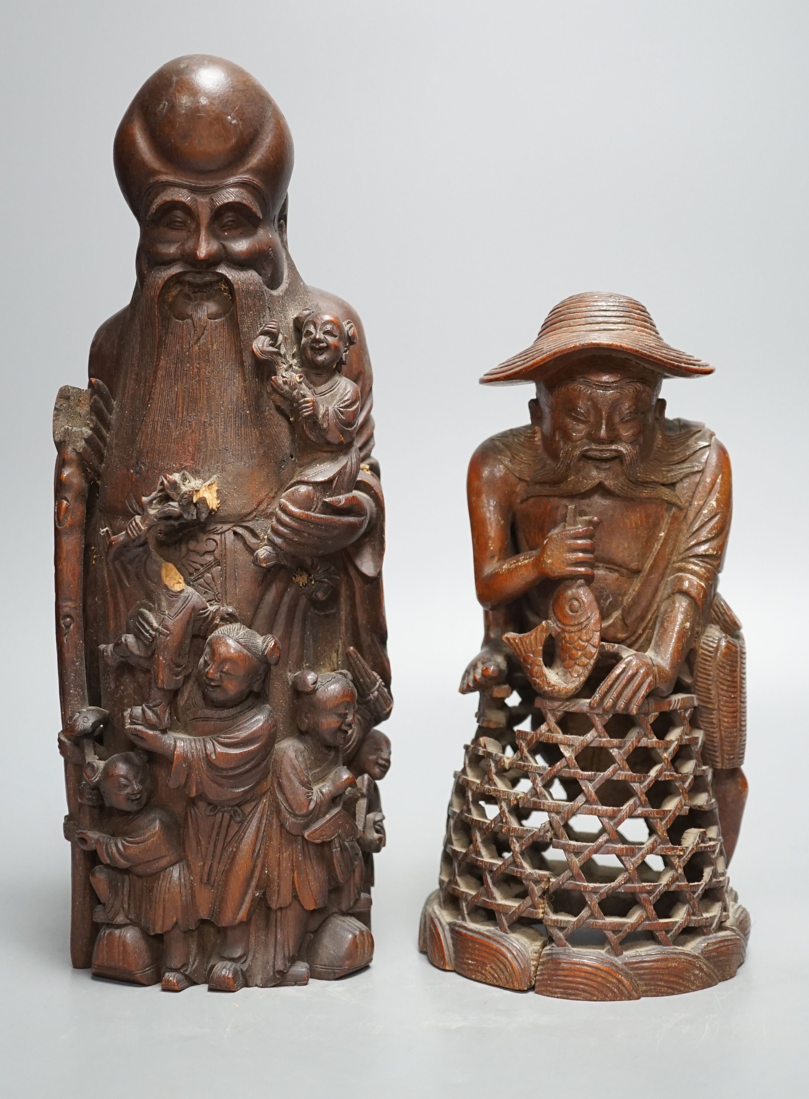 A 19th century Chinese bamboo figure of Shou Lao and a similar bamboo carving of a fisherman, 32 and 25cm, some losses